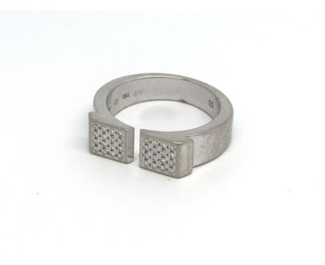 An 18ct white gold and diamond set Omega ring. (M), 9g.