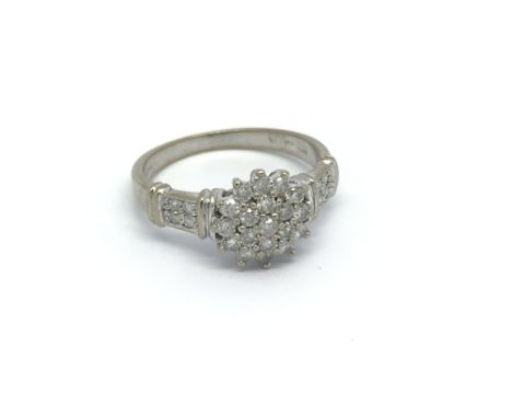 A 9ct white gold diamond cluster ring, approx 1/2ct, approx 2.6g and approx size L-M.