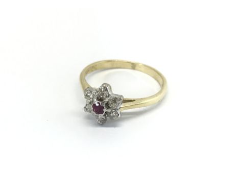 An 18carat gold ring set with a ruby and brilliant cut diamonds ring size K