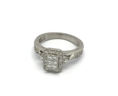 A Palladium diamond set ring with a rectangular pattern of diamonds. ring size H