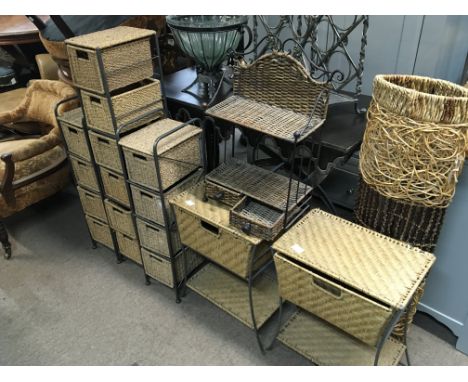 A collection of modern metal and wicker storage units and a conforming modern lamp.