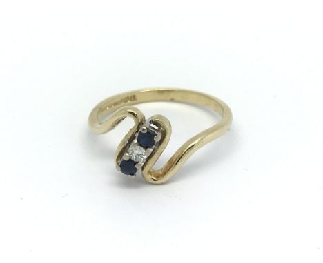 An 18ct sapphire and diamond ring, approx 3.2g, (P.5).