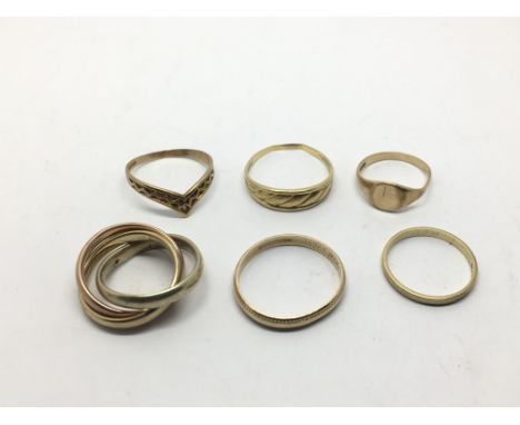 A collection of six 9ct gold rings including a Russian type wedding ring, approx 12.7g.