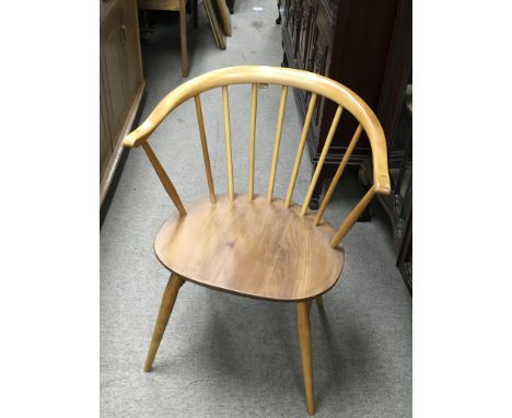 A single Ercol elm and beechwood arm chair.