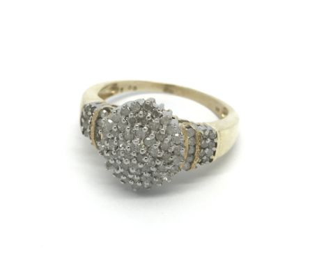 A 9carat gold ring set with a cluster of diamonds ring size V-W