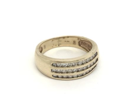 A 9carat gold ring set with three rows of diamonds ring size O