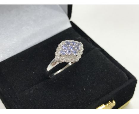 A 9ct white gold tanzanite And diamond cluster ring.