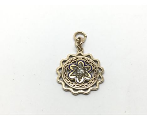 An unmarked gold pendant set with enamel and old cut diamonds, approx 3.9g.