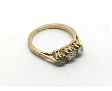 An 18ct gold ring set with three old cut diamonds, approx 3g and approx size L.