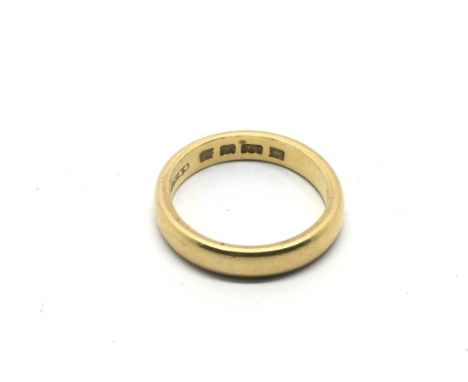 A 22ct gold wedding band, approx 5.2g and approx size K-L.