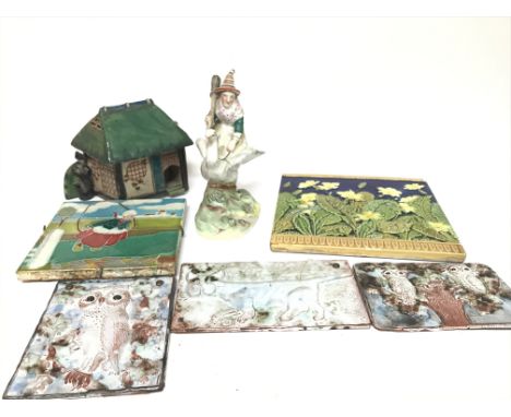 A 19th century Staffordshire figure a witch on a bird a Victorian majolica Minton tile a Japanese model of a cottage and thre