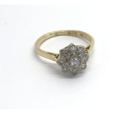 A 9carat gold ring set with a pattern of diamonds ring size K.