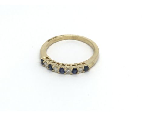 An 18ct diamond and sapphire ring, (N), 2.7g.