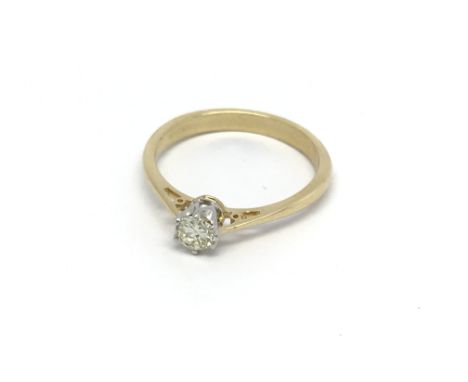 An 18carat gold solitaire diamond ring. the brilliant cut diamond of good colour G-H and good clarity approximately 0.25 of a