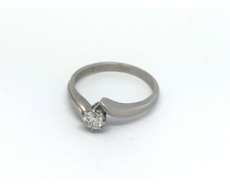 An 18ct white gold solitaire diamond ring, approx .20ct, approx 3.3g and approx size N-O.