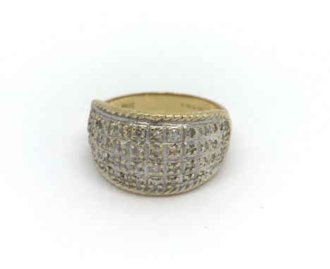 An 18carat gold ring set with four rows of diamonds. ring size M-N