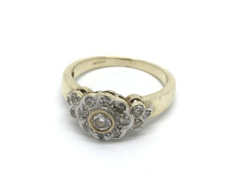 A 9carat gold ring set with a pattern of diamonds. ring size Q-R