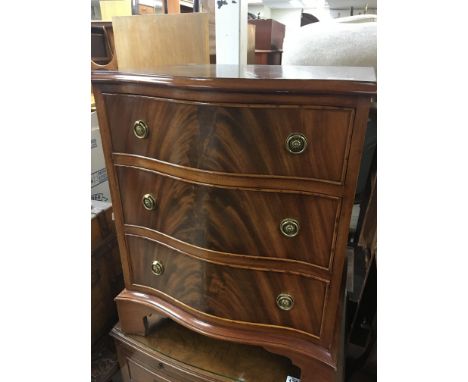 A Quality small size mahogany chest of three drawers, serpentine fronted. With three drawers. 66cm high 53cm wide - NO RESERV