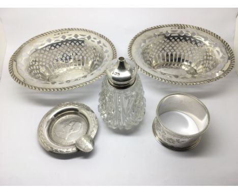 A small collection of silver including a pair of piercework dishes, napkin ring etc.