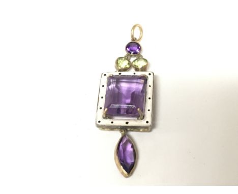 An Enamel and gold (no marks) pendent set with amethyst coloured stones and green peridot type stones 5.2cm