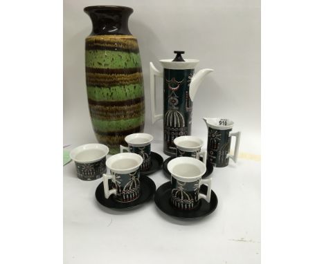 A Portmeirion Magic city coffee set with four cups and saucers and a west German vase .