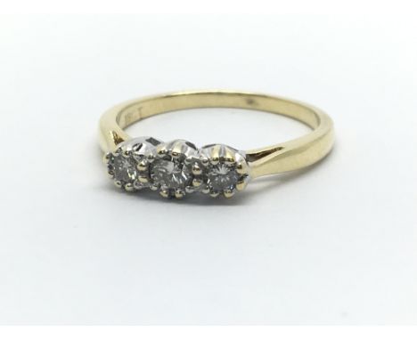 An 18ct yellow gold and three stone diamond ring, approx 0.25ct, ring size approx K