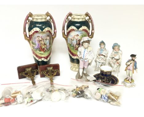 A collection of late 19th century ceramics bisque figures silver mounted Copland cup and saucer miniature oddments and a pair