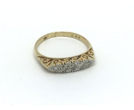 An 18ct gold five stone diamond ring, approx .15ct, approx 3.5g and approx size Q.