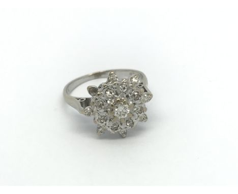 An 18carat white gold diamond cluster ring. ring size M.