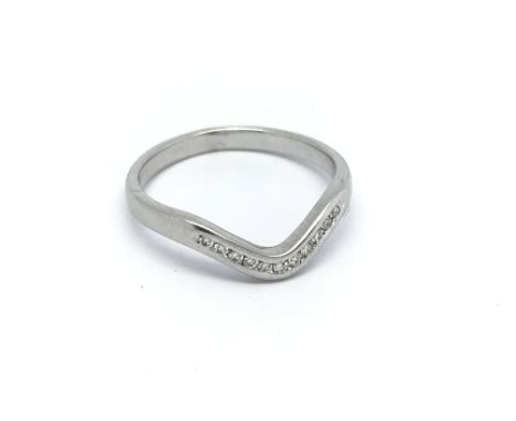 An 18ct white gold diamond wishbone ring, approx .10ct, approx 2.8g and approx size N.