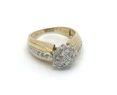 An 18ct gold and diamond cluster ring, approx 0.50ct. (O), 4.8g.