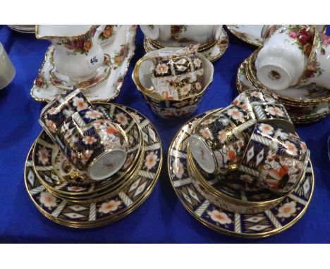 A Royal Crown Derby 2451 pattern part teaset comprising five cups, six saucers, plates, milk jug and sugar bowl Condition Rep