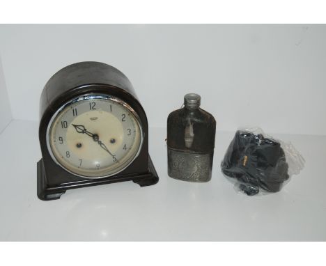 A Smiths Enfield mantle clock, white-metal hip flask and Nikon Sprint IV binoculars Condition Report: Available upon request