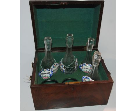 A mahogany six bottle liqueur case with ceramic labels with carry handles, 27cm wide Condition Report: Available upon request