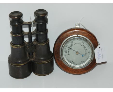 A pair of vintage binoculars and a small oak cased barometer, 12cm  (2) Condition Report: Available upon request