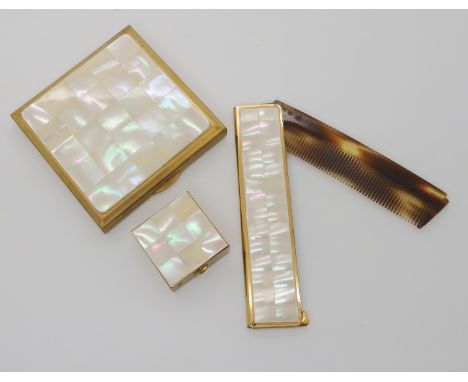 A Kigu mother of pearl compact with a further comb cover and pillbox Condition Report: Not available for this lot