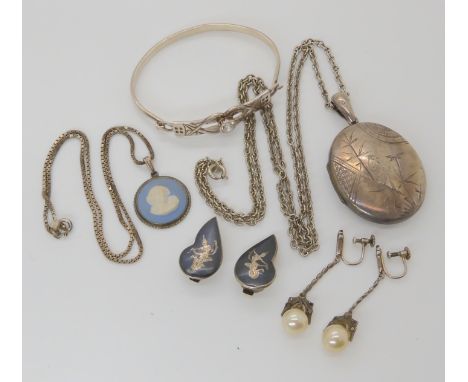 A silver locket hallmarked 1880, a silver mounted Wedgwood pendant, and a Mackintosh bangle etc Condition Report: Not availab