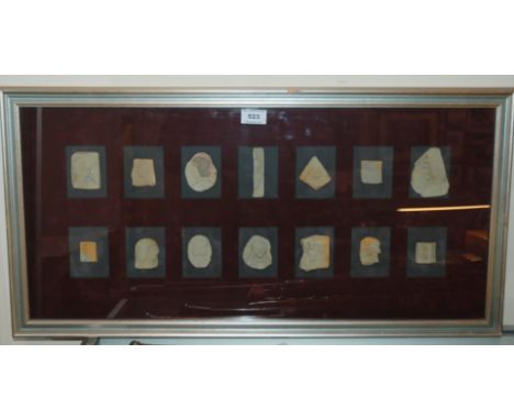 A framed display of ceramic shards, in common mount, 40 x 80cm Condition Report: Available upon request