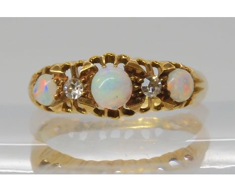 An 18ct gold opal and diamond ring, hallmarked 1918, size O, weight 3.3gms Condition Report: Available upon request