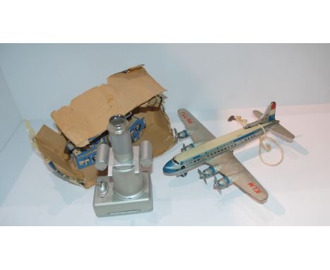 An Arnold West German tip plate aeroplane and a Johnson-Disney Film Strip Projector (2) Condition Report: Available upon requ