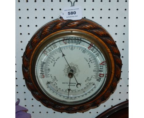 An oak cased circular barometer by Whyte Thomson &amp; Co, Glasgow, 23cm wide Condition Report: Available upon request