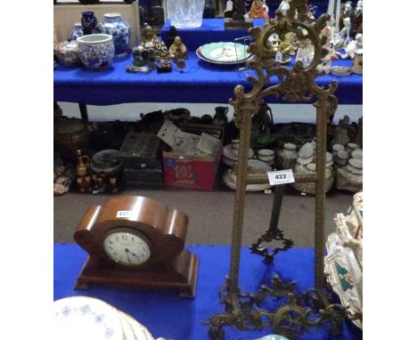 A brass easel frame and a Camerer Cuss &amp; Co mantle clock Condition Report: Available upon request