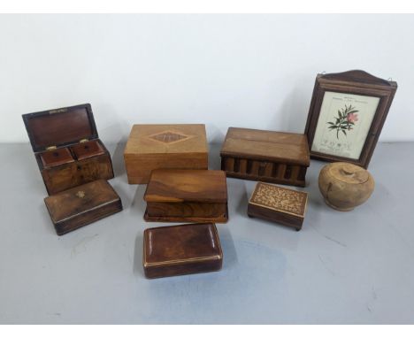 A group of treen boxes to include Victorian walnut tea caddy, on inlay musical box, botanical key holder and othersLocation: 