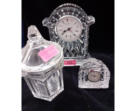 Three pieces of glassware to include a Waterford glass encased mantel clock Location: 