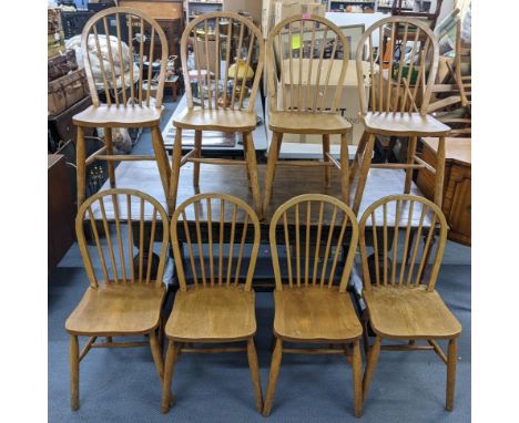 A set of eight Ercol inspired elm and beech stick back chairs Location: 