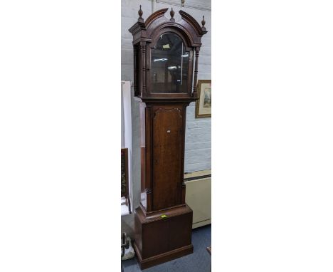 A Georgian oak longcase clock case having turned pillars flanking the arched top case 217cm h x 57cm w Location: 