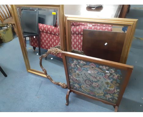 Two modern gold framed wall mirrors, a mid 20th century gilt wall mirror and an early 20th century oak fire screen with inset