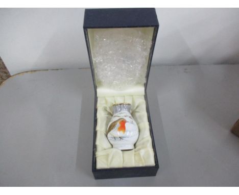 A Moorcroft boxed miniature enamel vase decorated with robins Location: 