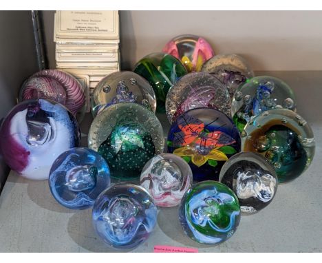 A collection of sixteen Caithness paperweights, in various sizes, most signed or numbered, together with standsLocation: 10:2
