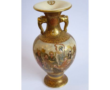 A small circa 1900&nbsp;Japanese two-handled vase; enamel and gilt decorated with a lady painting and other figures, the reve